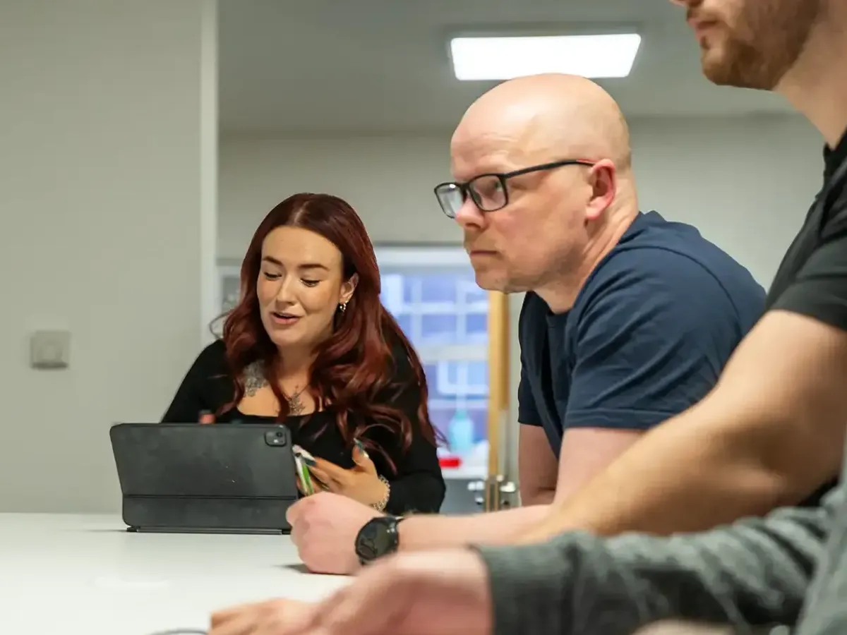 Image of several Hydra staff members engaged in a meeting. Image of several Hydra staff members engaged in a meeting.
